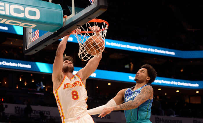 Jan 23, 2022; Charlotte, North Carolina, USA; Atlanta Hawks forward Danilo Gallinari (8) dunks as he is defended by Charlotte Hornets forward PJ Washington (25) during the first half at The Spectrum Center.